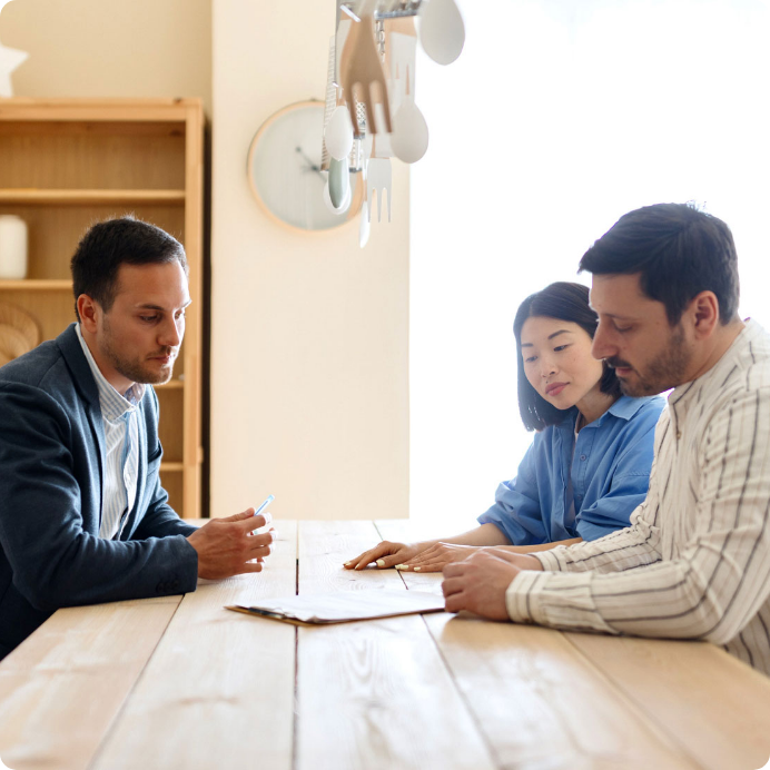 Couple-signing-contract-for-their-new-home